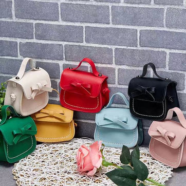 Adorable Children's Bowknot Mini Shoulder Bag - Cute PU Leather Crossbody Purse for Girls